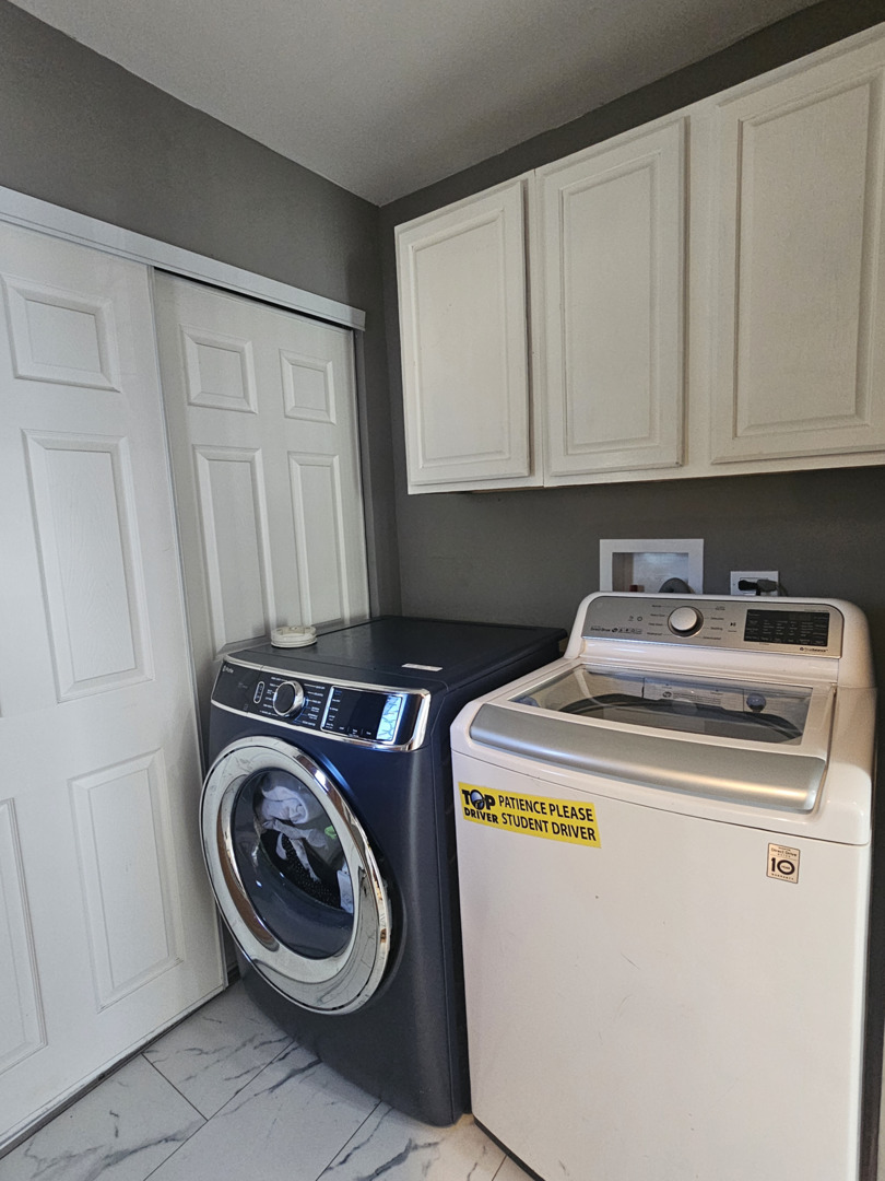1353 Spring Valley Drive Carol Stream, IL 60188 - Photo 19 of 25 a utility room with dryer and washer