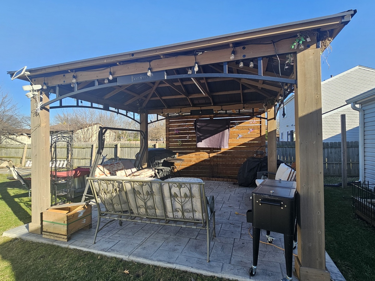 1353 Spring Valley Drive Carol Stream, IL 60188 - Photo 20 of 25 a view of a chair and table in patio with wooden fence