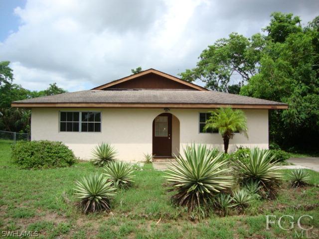 19055 Evergreen Road Fort Myers, FL 33967 - Photo 1 of 9 a front view of house with yard and seating space