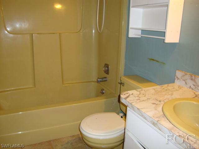 19055 Evergreen Road Fort Myers, FL 33967 - Photo 5 of 9 a bathroom with a sink a toilet and shower