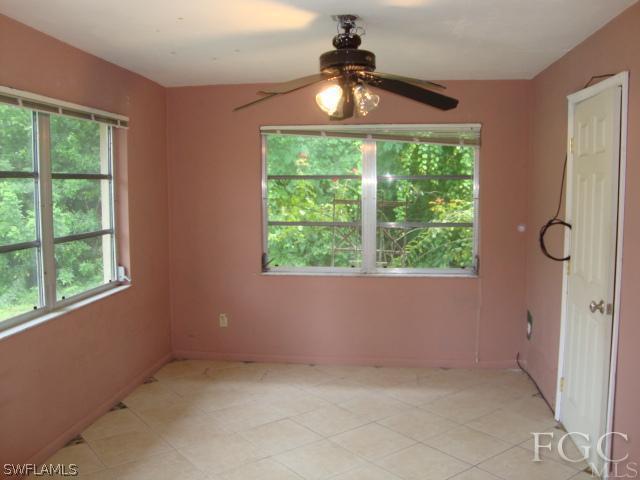 19055 Evergreen Road Fort Myers, FL 33967 - Photo 7 of 9 a view of an empty room with a window