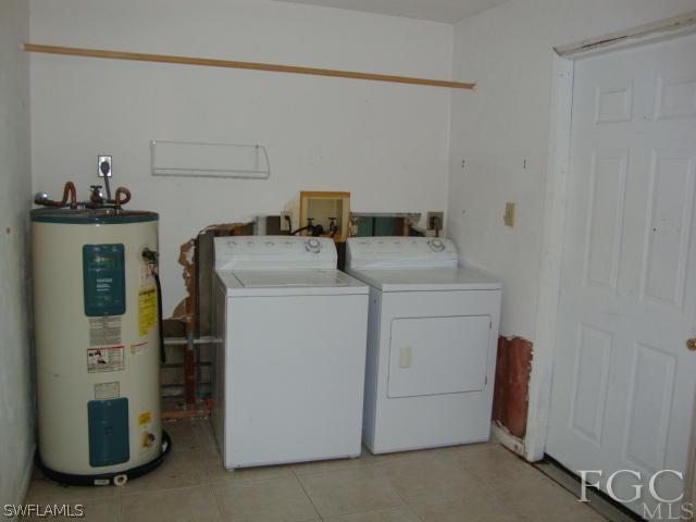 19055 Evergreen Road Fort Myers, FL 33967 - Photo 8 of 9 a utility room with dryer and washer