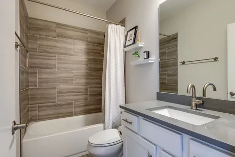 a bathroom with a sink and mirror