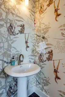 a view of a balcony with wooden floor next to a lake