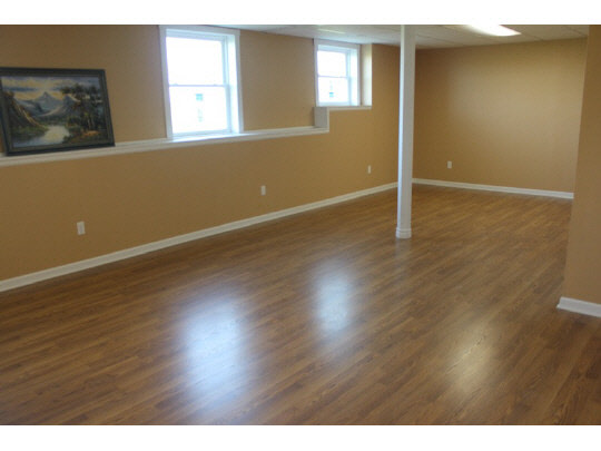 11897 Smith Road Pecatonica, IL 61063 - Photo 11 of 11 a view of an empty room with wooden floor and a window