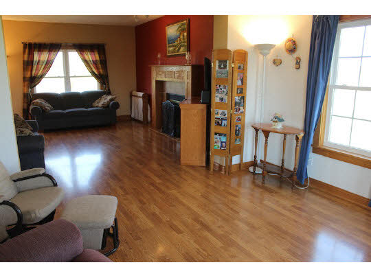 11897 Smith Road Pecatonica, IL 61063 - Photo 4 of 11 a living room with furniture and a flat screen tv