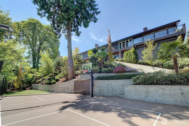 a view of a house with backyard sitting area and garden