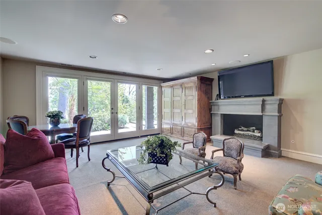 a spacious bedroom with a bed a table and chair