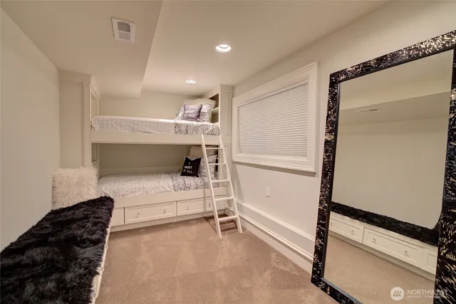 a bed room with a bed and a large window