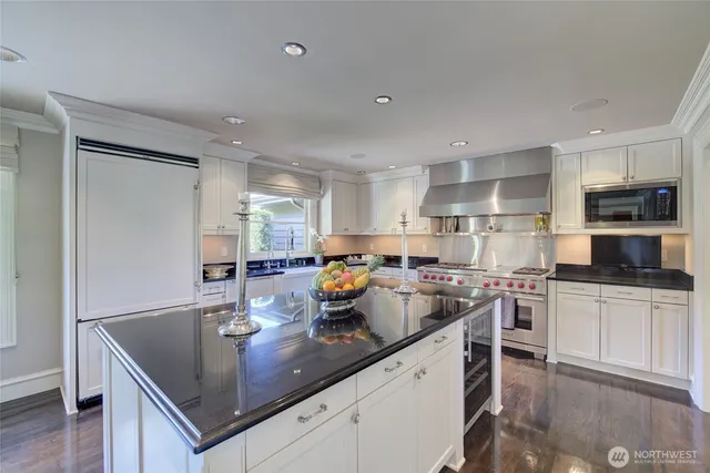 a kitchen with a sink and a stove top oven