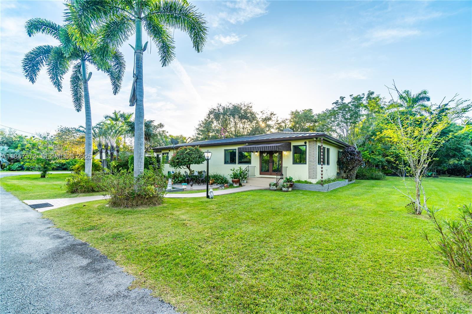 18200 Southwest 296th Street Homestead, FL 33030 - Photo 1 of 55 a view of a house with backyard and a patio