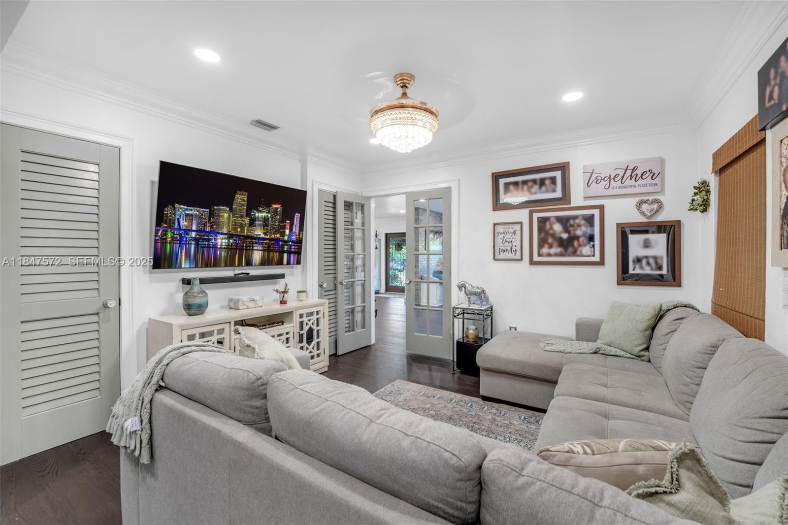18200 Southwest 296th Street Homestead, FL 33030 - Photo 16 of 55 a living room with furniture and a flat screen tv