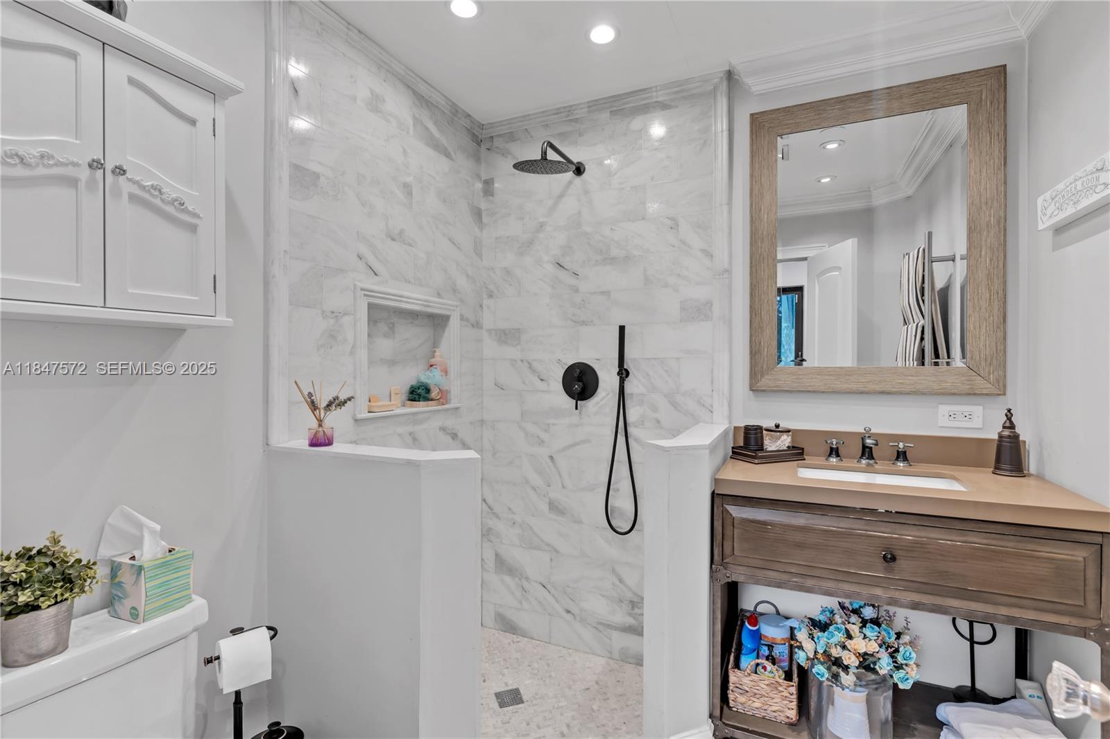 18200 Southwest 296th Street Homestead, FL 33030 - Photo 18 of 55 a bathroom with a sink a toilet and shower