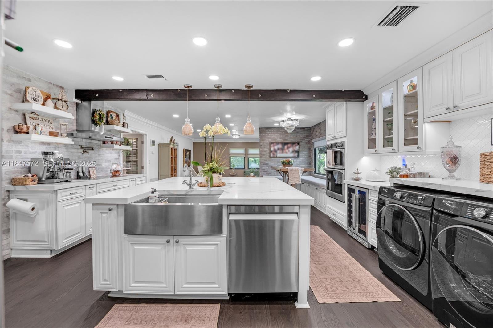 18200 Southwest 296th Street Homestead, FL 33030 - Photo 2 of 55 a kitchen with kitchen island granite countertop lots of white stainless steel appliances