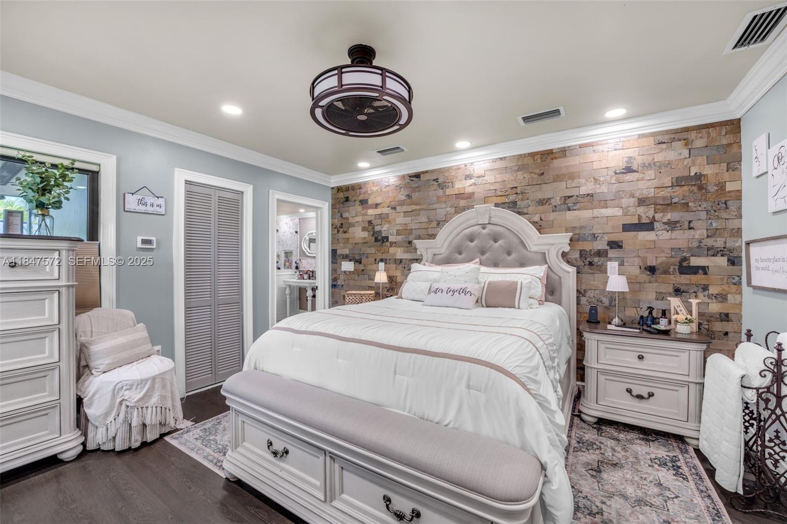 18200 Southwest 296th Street Homestead, FL 33030 - Photo 21 of 55 a bedroom with a bed and a chandelier