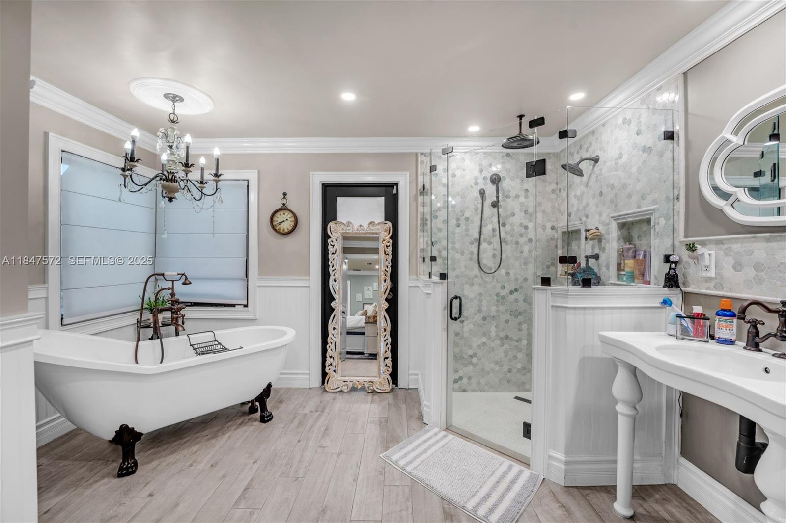 18200 Southwest 296th Street Homestead, FL 33030 - Photo 3 of 55 a spacious bathroom with a bathtub shower sink and mirror