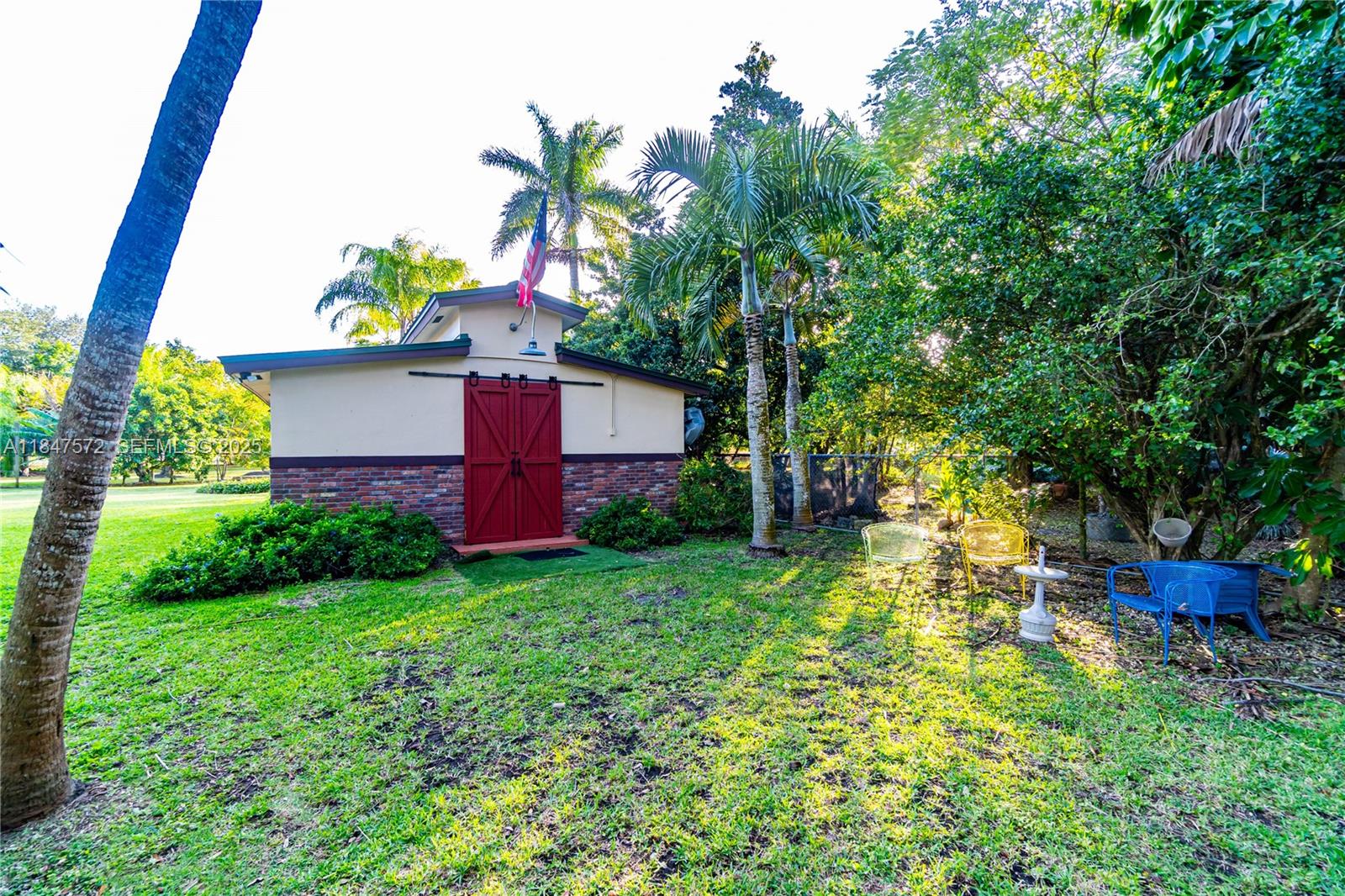 18200 Southwest 296th Street Homestead, FL 33030 - Photo 33 of 55 a backyard of a house with lots of green space