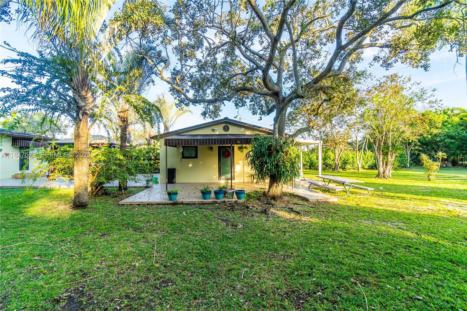 18200 Southwest 296th Street Homestead, FL 33030 - Photo 36 of 55 a view of a house with a yard and tree s