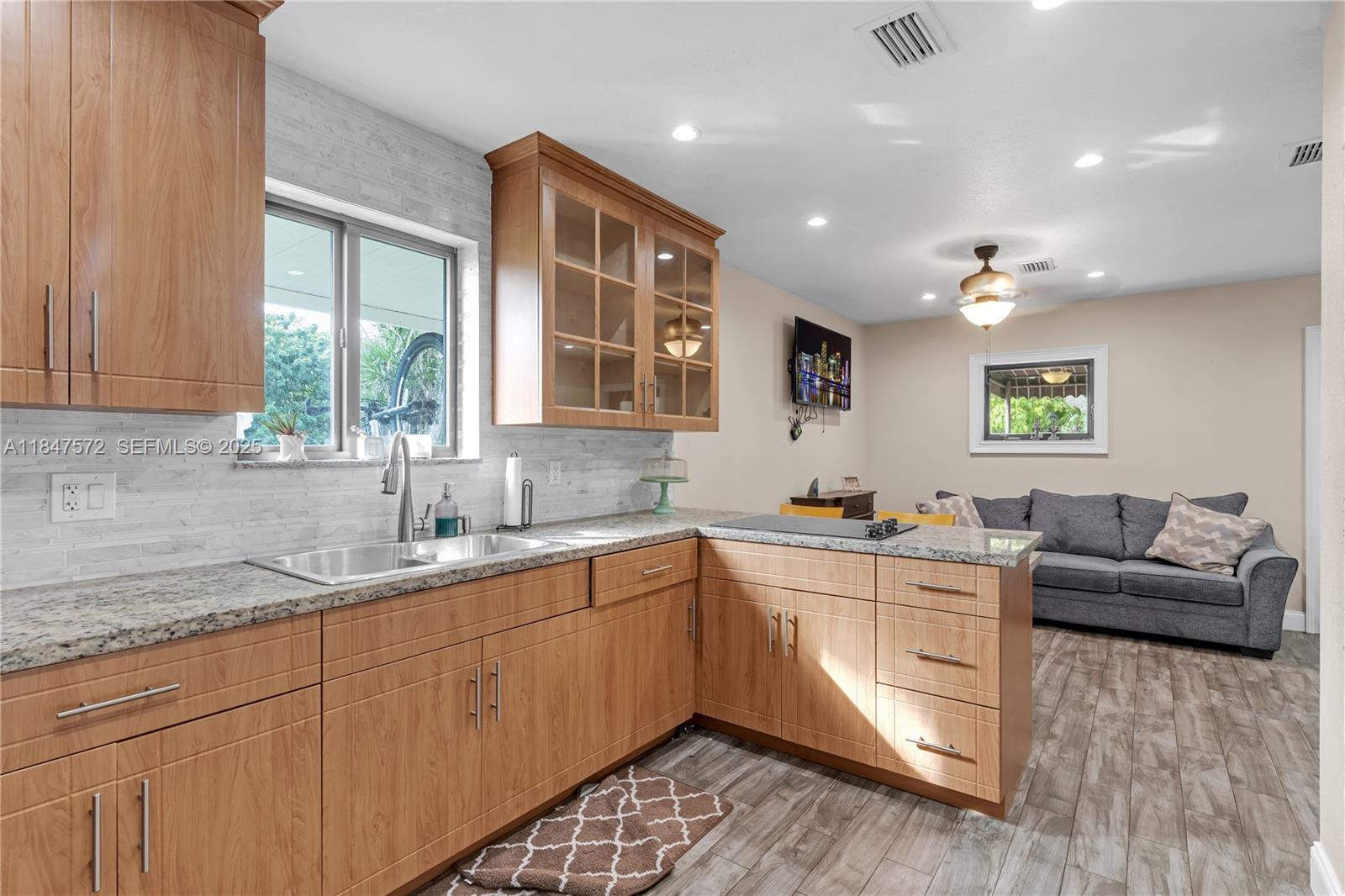 18200 Southwest 296th Street Homestead, FL 33030 - Photo 39 of 55 a kitchen with granite countertop a sink and window