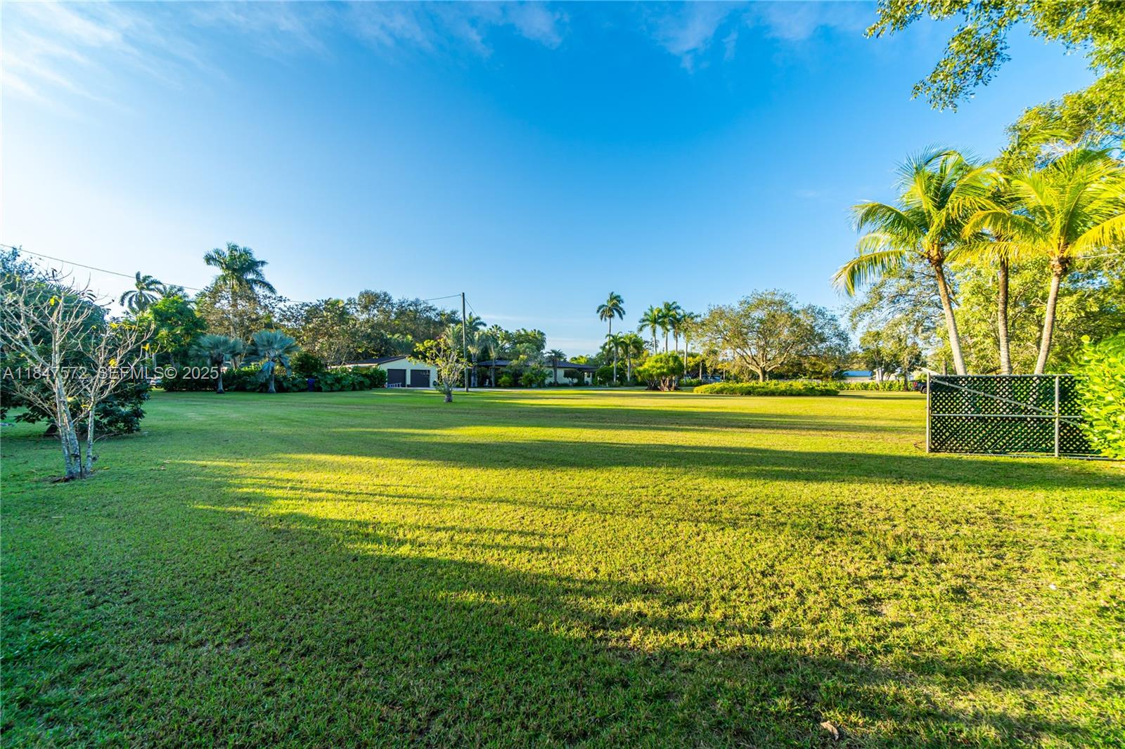 18200 Southwest 296th Street Homestead, FL 33030 - Photo 48 of 55 a view of a golf course with a lake