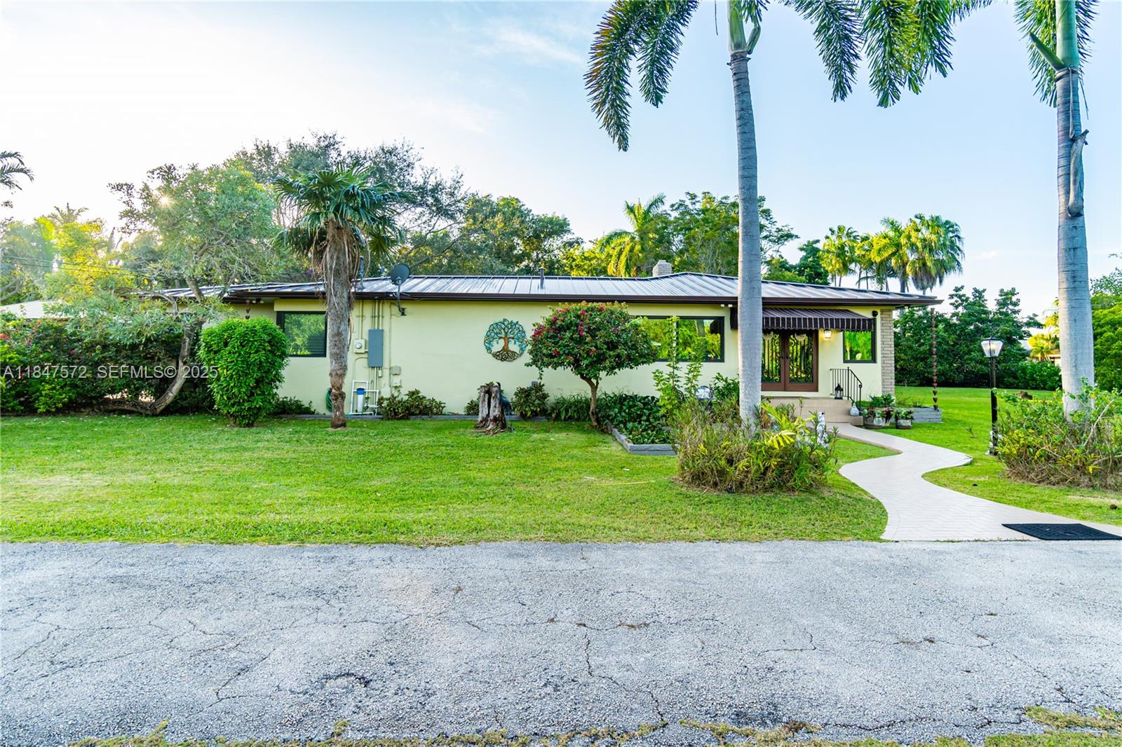 18200 Southwest 296th Street Homestead, FL 33030 - Photo 50 of 55 a front view of a house with garden