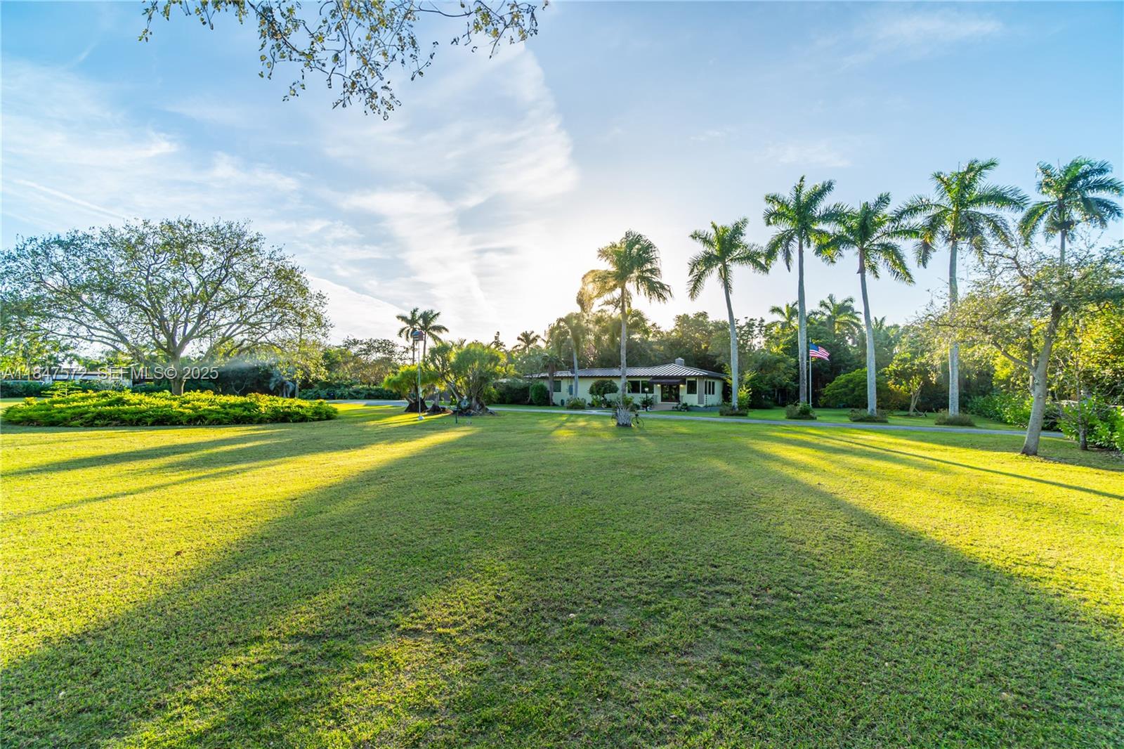 18200 Southwest 296th Street Homestead, FL 33030 - Photo 51 of 55 a view of a swimming pool with an outdoor space and seating area