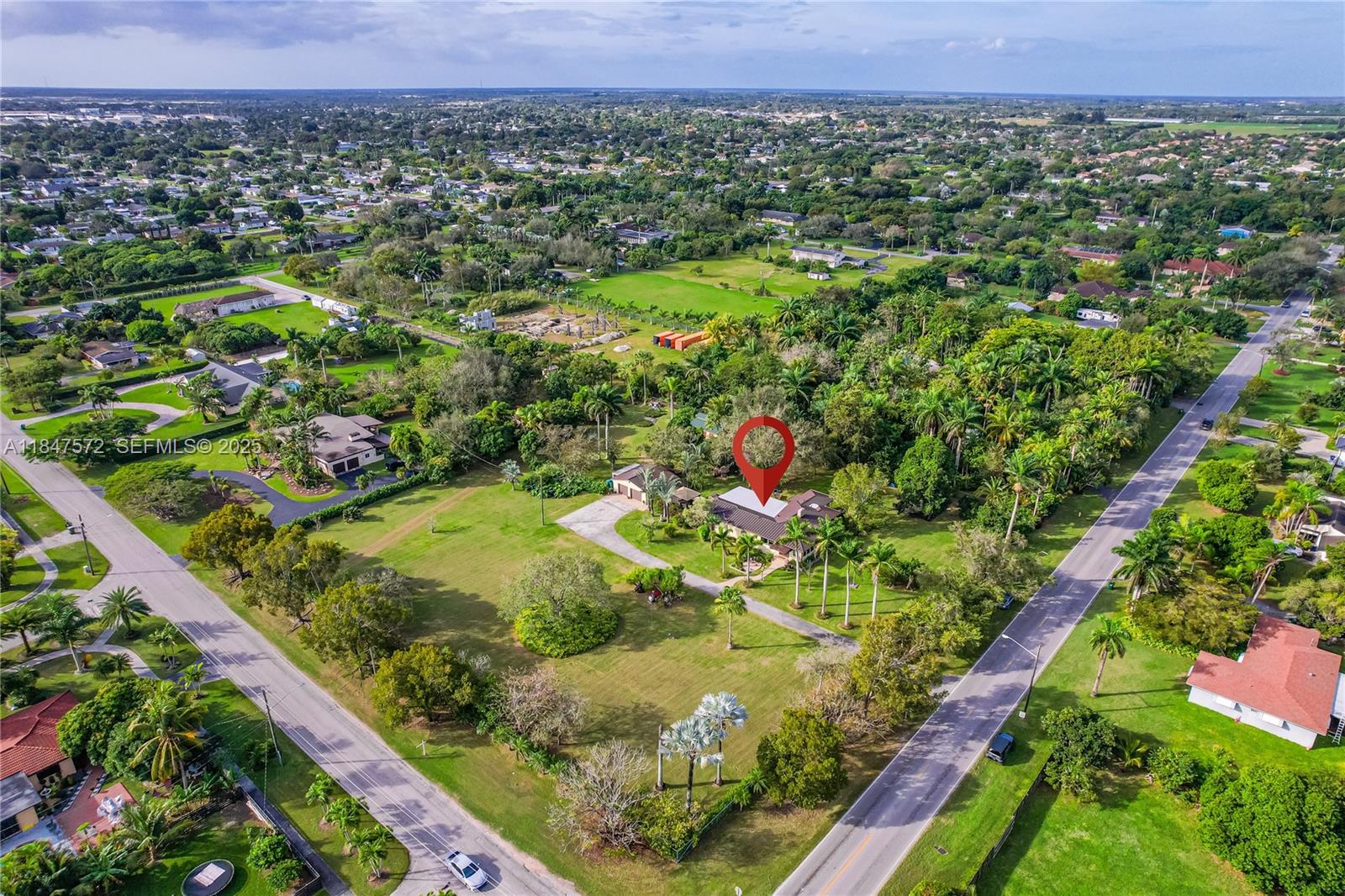 18200 Southwest 296th Street Homestead, FL 33030 - Photo 52 of 55 a view of a lush green forest with lots of residential buildings