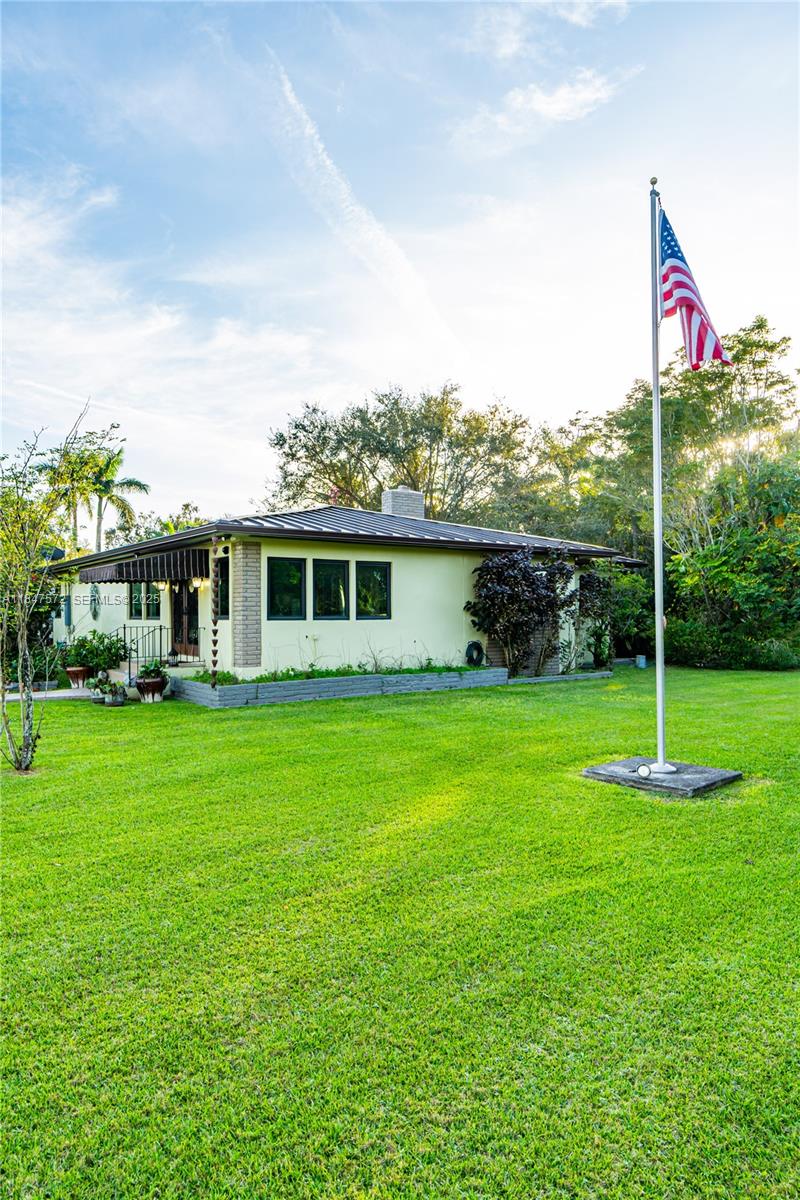 18200 Southwest 296th Street Homestead, FL 33030 - Photo 9 of 55 a front view of a house with a yard