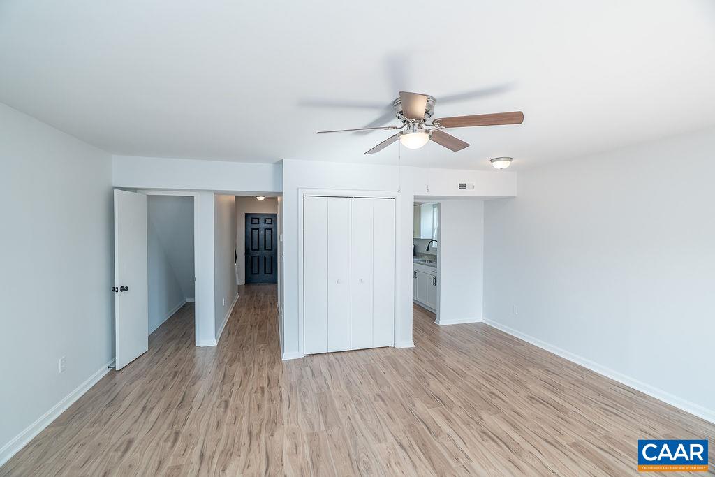 2087 Commonwealth Drive Charlottesville, VA 22901 - Photo 13 of 44 a view of empty room with wooden floor