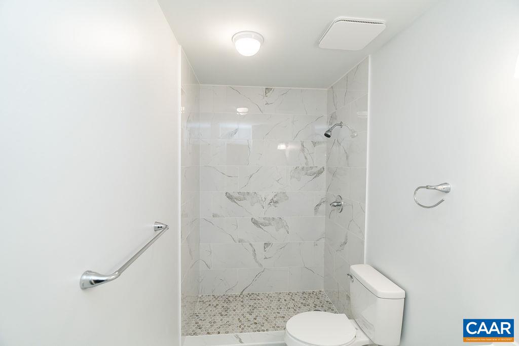 2087 Commonwealth Drive Charlottesville, VA 22901 - Photo 22 of 44 a bathroom with a shower and toilet