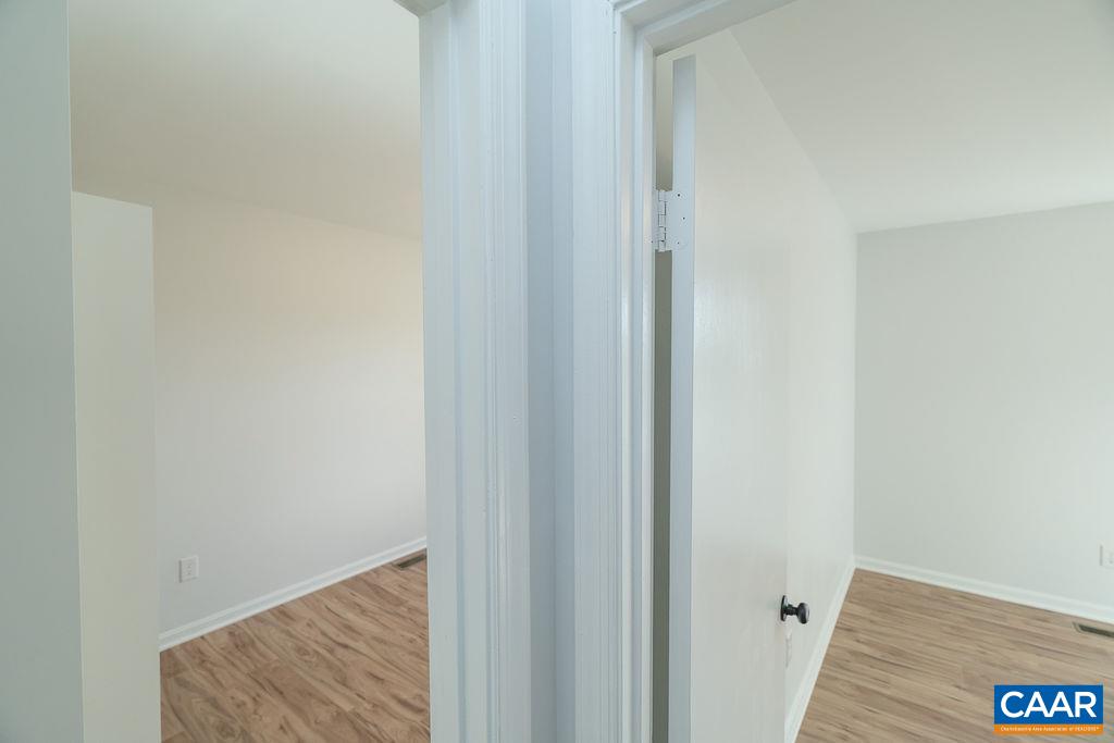 2087 Commonwealth Drive Charlottesville, VA 22901 - Photo 23 of 44 a view of hallway with wooden floor