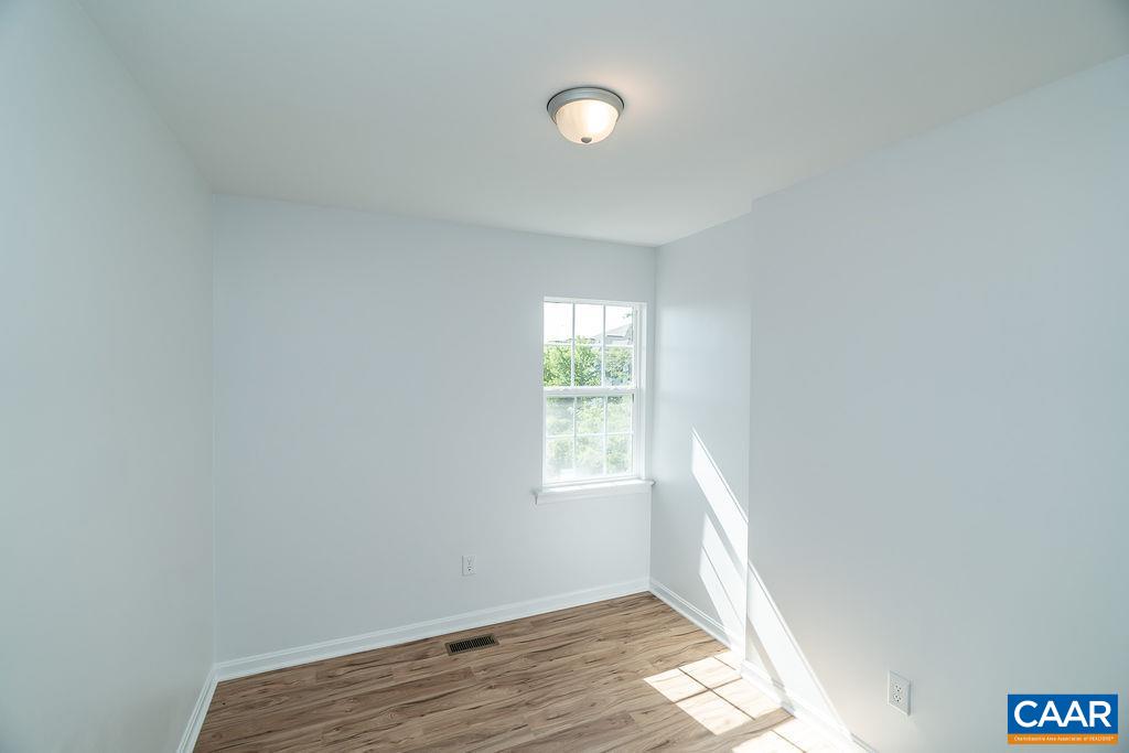 2087 Commonwealth Drive Charlottesville, VA 22901 - Photo 26 of 44 a view of an empty room and window