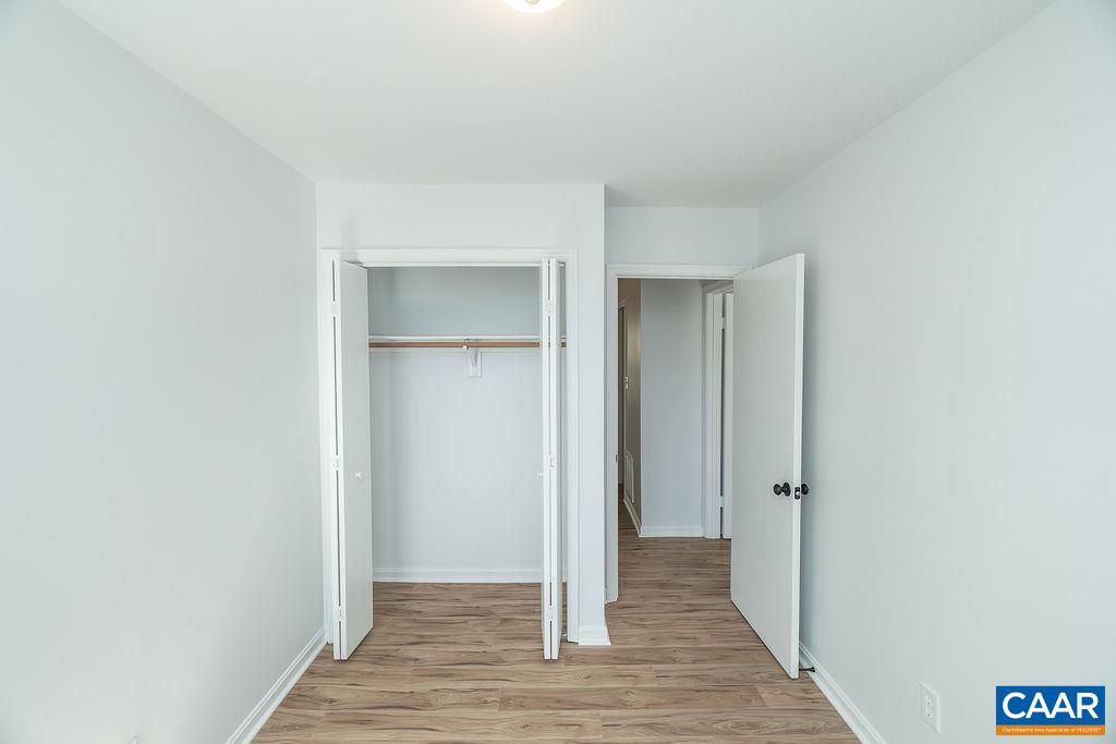 2087 Commonwealth Drive Charlottesville, VA 22901 - Photo 27 of 44 a view of a hallway with wooden floor