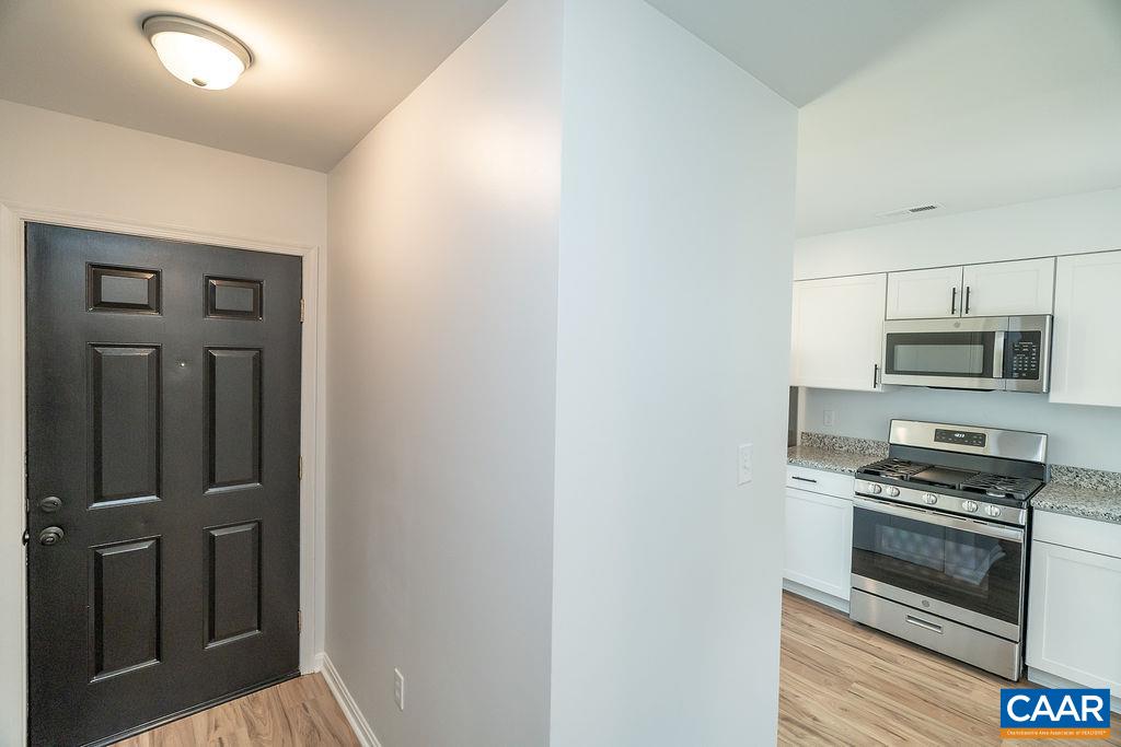 2087 Commonwealth Drive Charlottesville, VA 22901 - Photo 3 of 44 a kitchen with stainless steel appliances a refrigerator and stove
