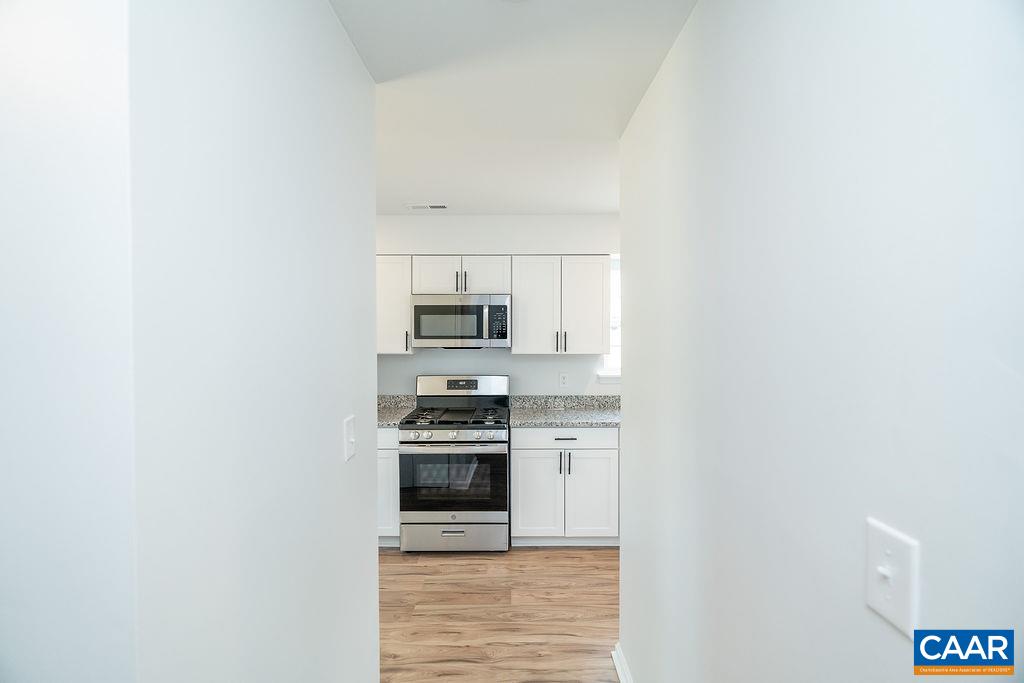 2087 Commonwealth Drive Charlottesville, VA 22901 - Photo 4 of 44 a kitchen with stainless steel appliances a stove and a refrigerator