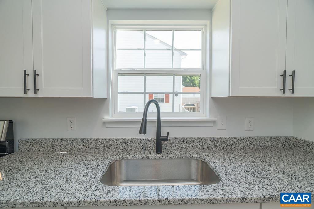 2087 Commonwealth Drive Charlottesville, VA 22901 - Photo 9 of 44 a kitchen with granite countertop a sink and a window