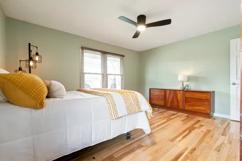 a bedroom with a bed and a dresser