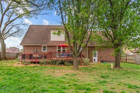 front view of a house with a big yard