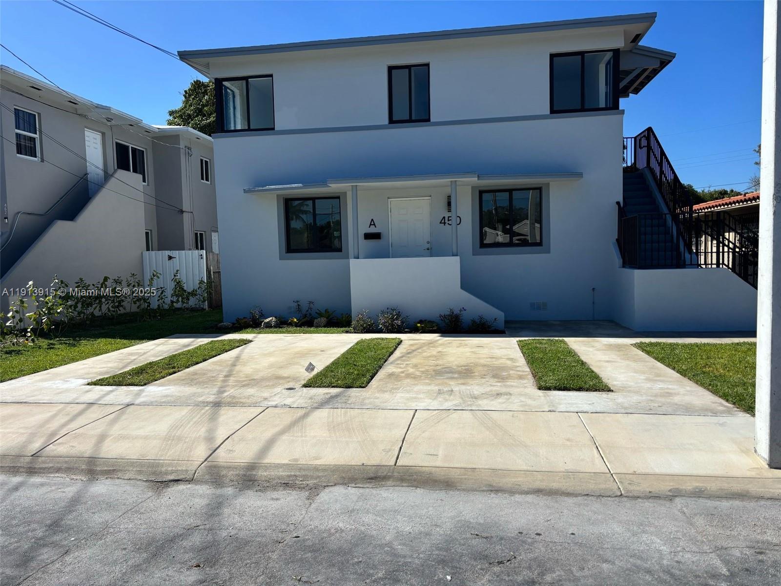 450 Beacom Boulevard, Unit B Miami, FL 33135 - Photo 1 of 11 a front view of a house with a yard