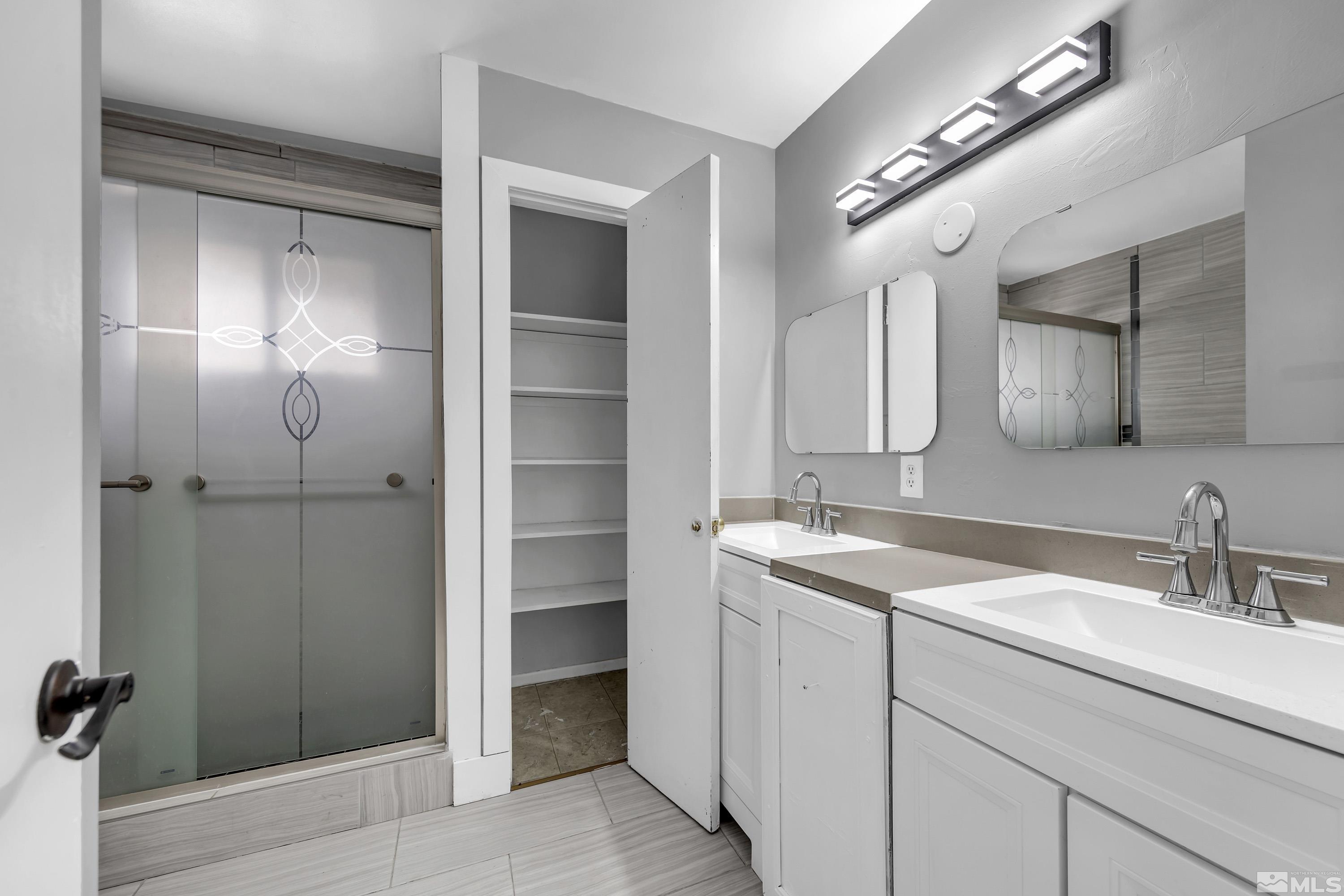 4 Smithridge Park Reno, NV 89502 - Photo 12 of 26 a bathroom with a sink and a mirror