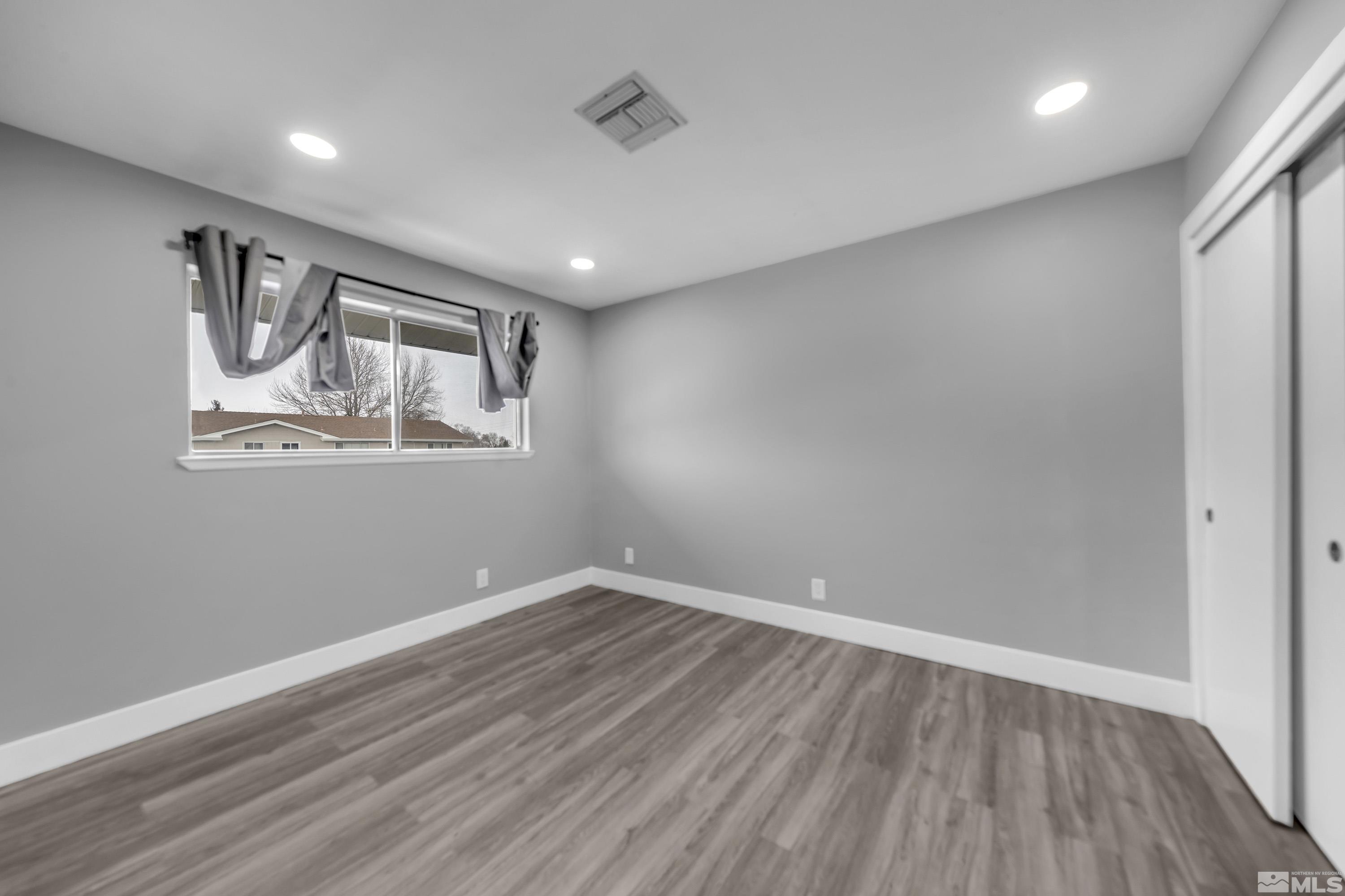 4 Smithridge Park Reno, NV 89502 - Photo 7 of 26 a view of empty room with wooden floor
