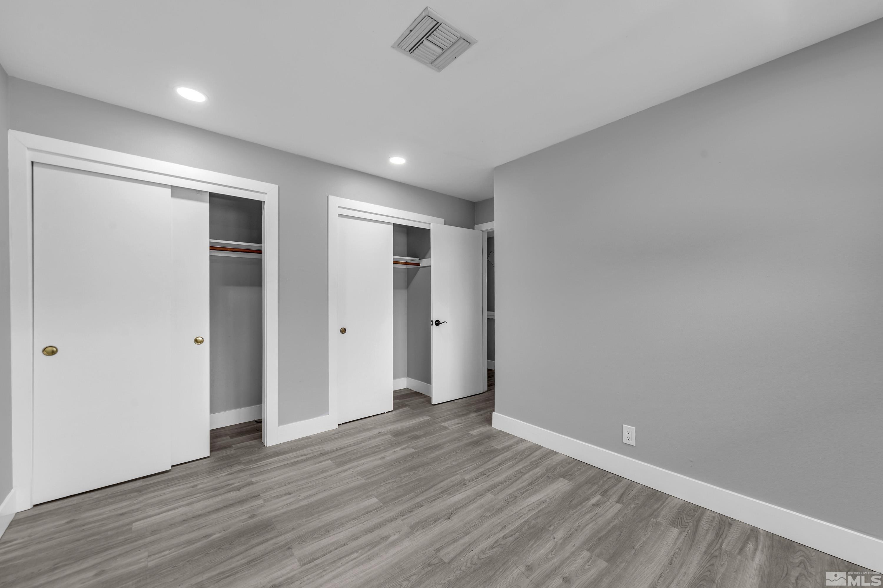 4 Smithridge Park Reno, NV 89502 - Photo 8 of 26 a view of an empty room with wooden floor