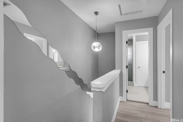 a view of a hallway with entryway door