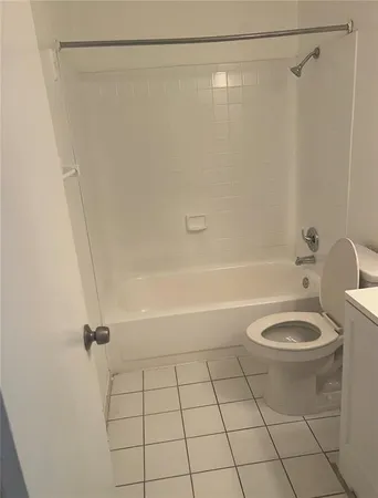 a bathroom with double sink and a mirror