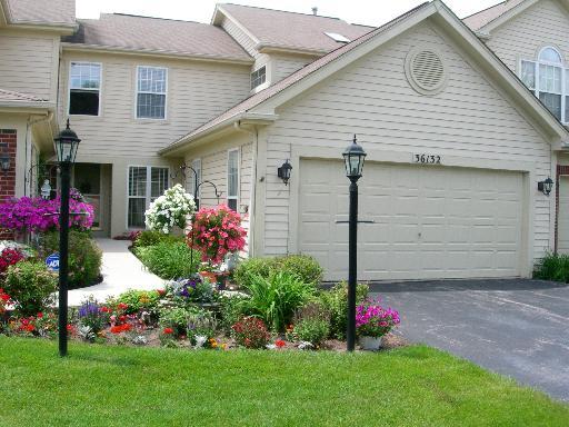 36132 North Springbrook Lane Gurnee, IL 60031 - Photo 1 of 30 a front view of a house with a yard and outdoor seating