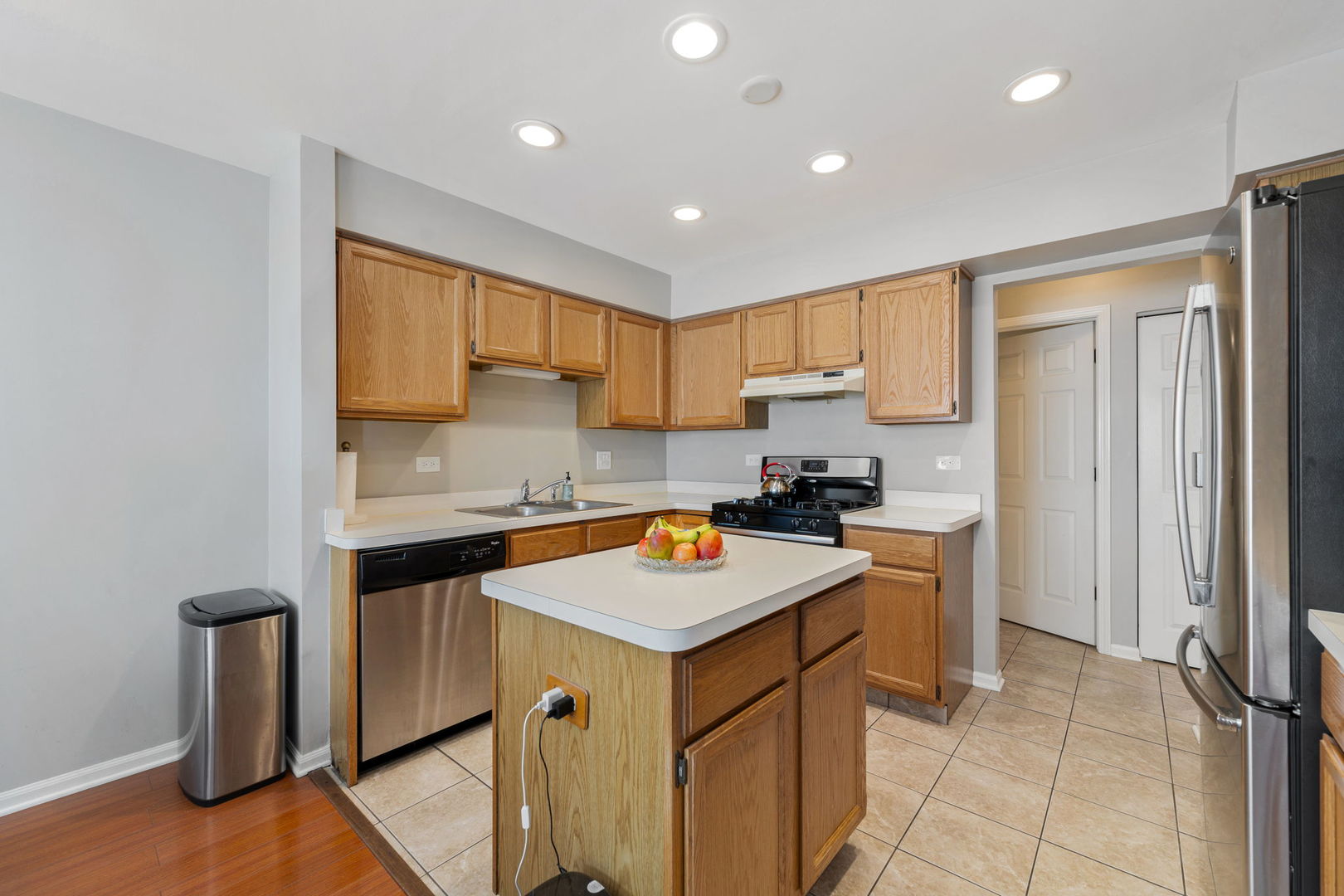 36132 North Springbrook Lane Gurnee, IL 60031 - Photo 11 of 30 a kitchen with stainless steel appliances granite countertop a sink stove and refrigerator