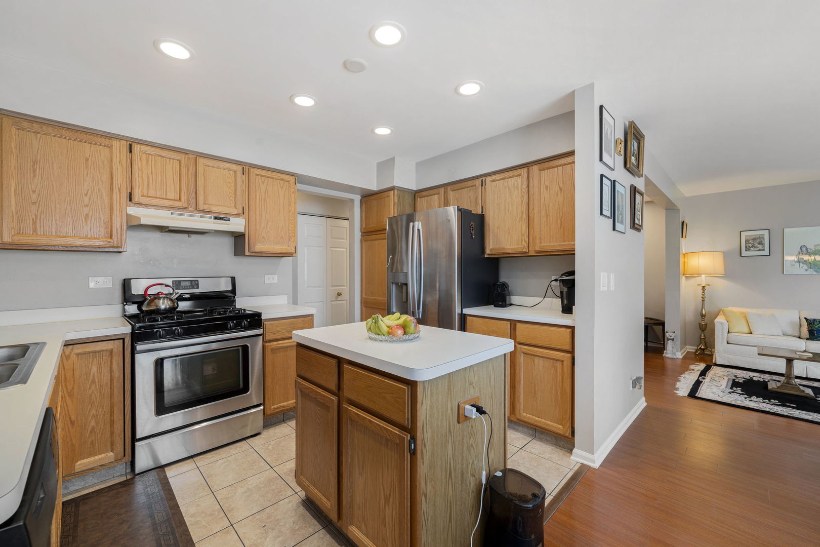 36132 North Springbrook Lane Gurnee, IL 60031 - Photo 12 of 30 a kitchen that has a sink a stove and a refrigerator