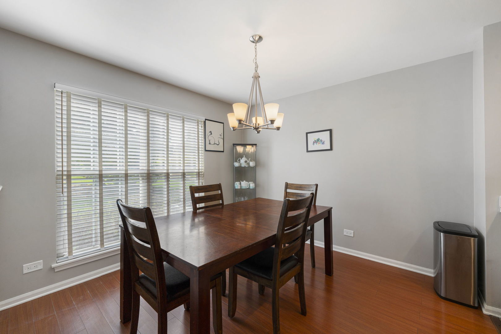 36132 North Springbrook Lane Gurnee, IL 60031 - Photo 10 of 30 a view of a dining room with furniture window and wooden floor