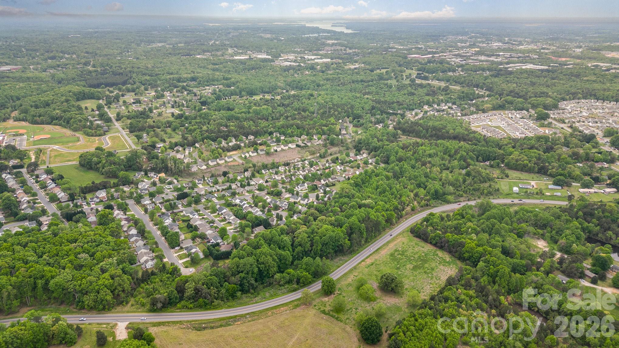 0 Connector Road Mooresville, NC 28117 - Photo 5 of 6 an aerial view of residential houses with outdoor space and trees