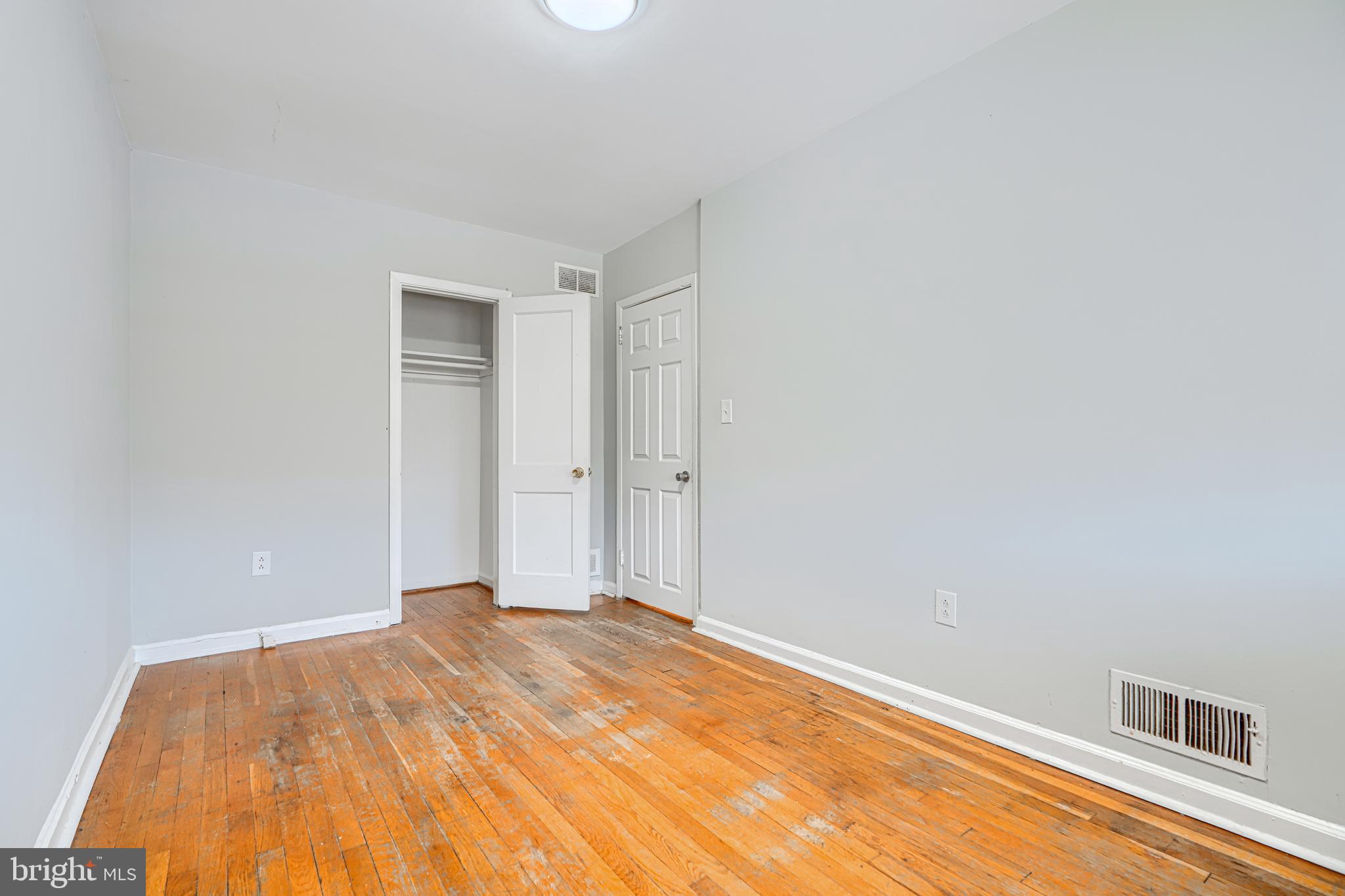 2073 Jasmine Road Baltimore, MD 21222 - Photo 14 of 29 a view of a room with wooden floor and a ceiling fan